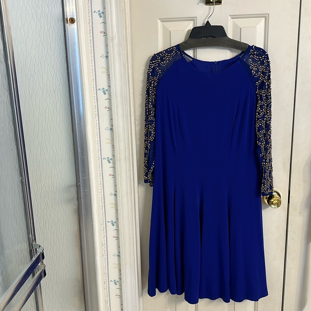 Formal dress with no tears, stains or rips. No missing beads. Size 16